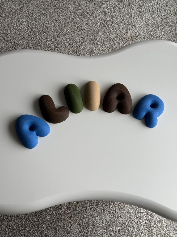 Blue and brown ALIIAR letters