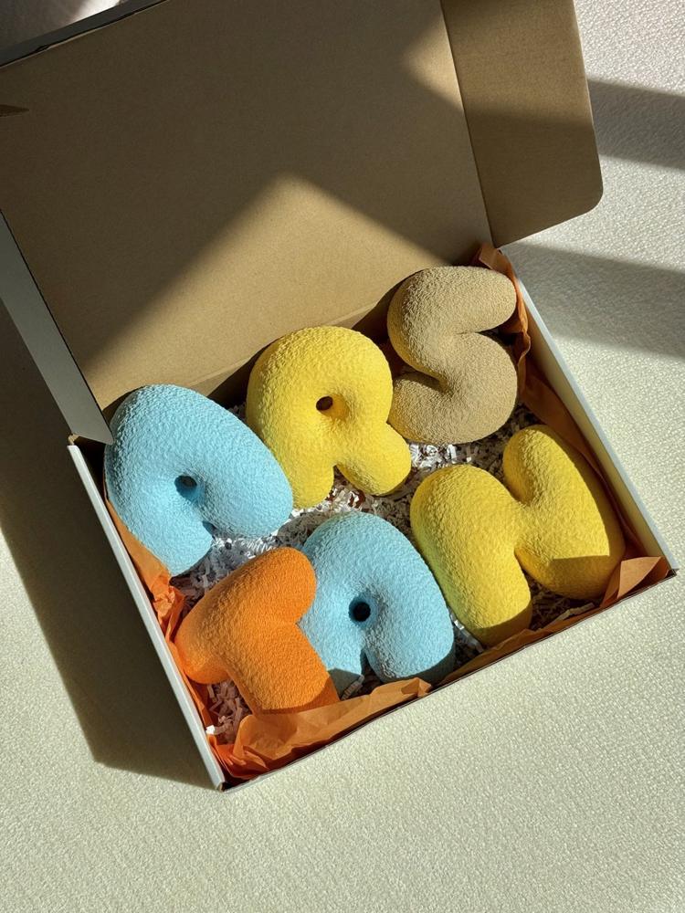 ARSTAN letters in a gift box